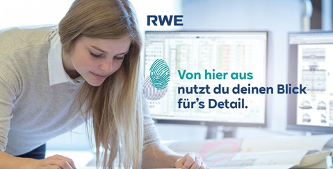 Eine Person arbeitet an einem Tisch mit mehreren Bildschirmen im Hintergrund. Grafiken und Daten sind sichtbar.