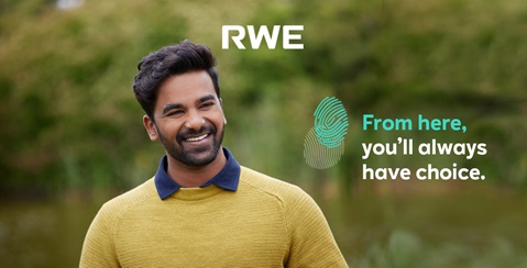 A person in a yellow sweater stands outdoors with greenery behind. The text reads, 'From here, you'll always have choice.
