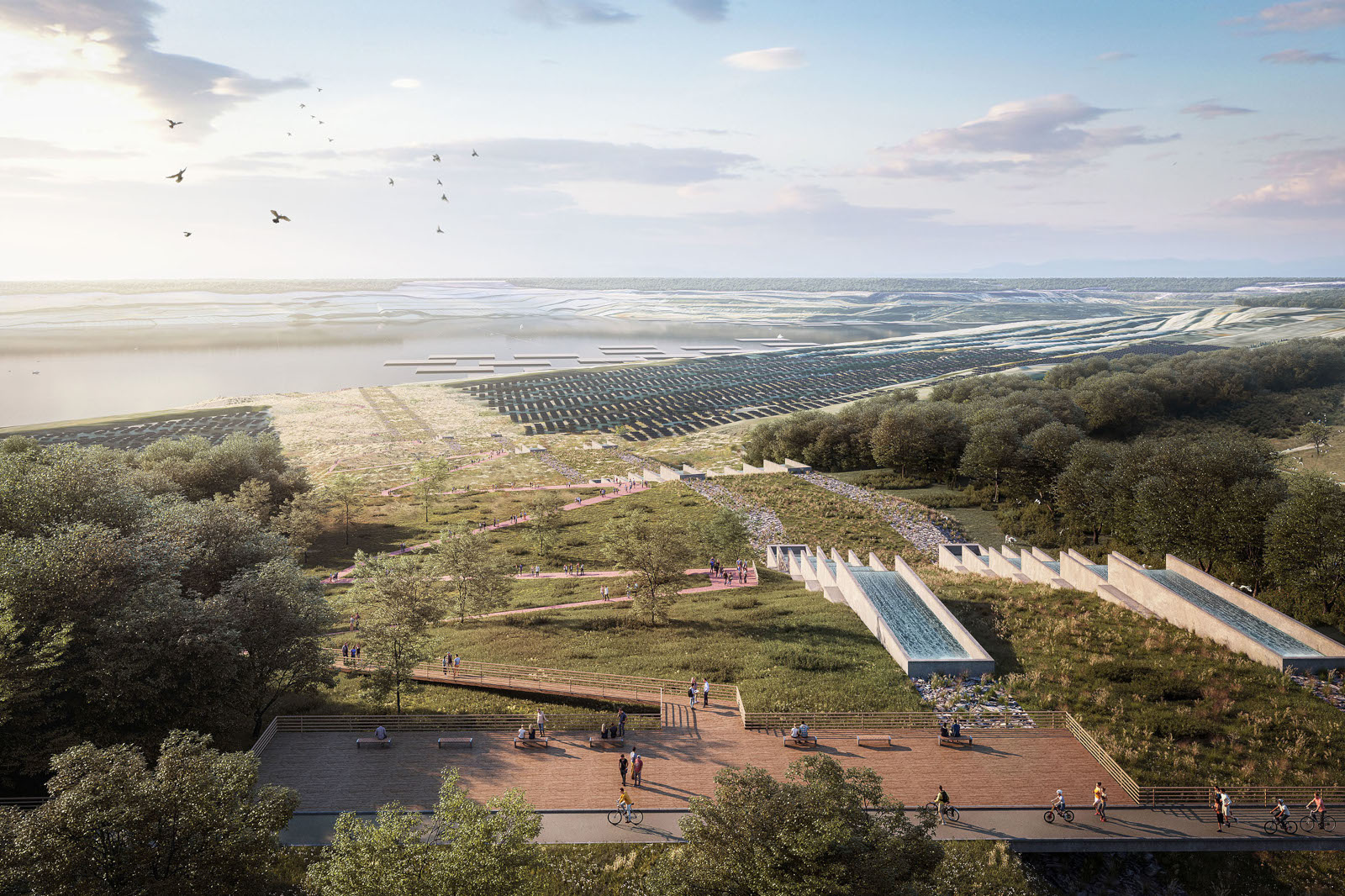 Eine landschaftliche Szene mit Menschen, die spazieren und Rad fahren. Es gibt Wasserkanäle, Grünflächen und Solarpanels im Hintergrund.
