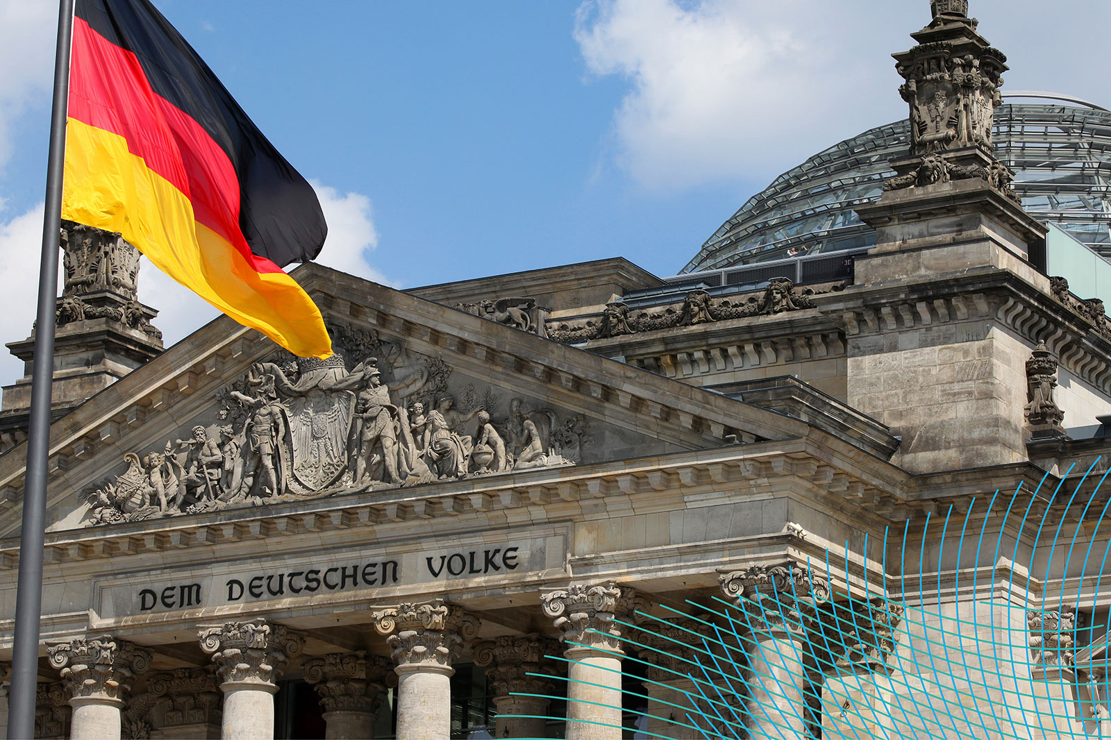 The German flag flies in front of the Reichstag in Berlin, featuring historic architecture and the inscription 'DEM DEUTSCHEN VOLKE'.