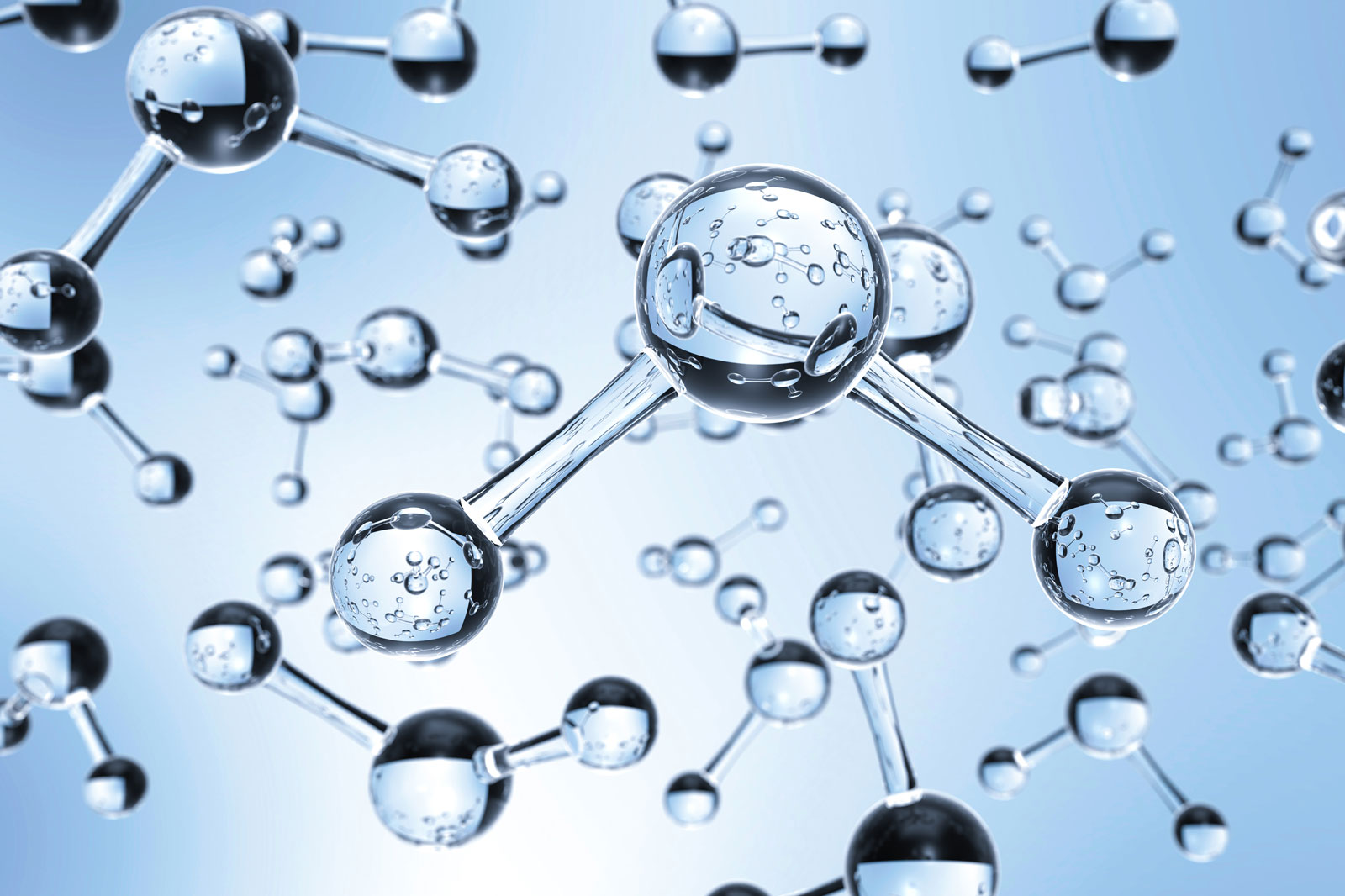 Molecules made of transparent water droplets against a light blue background, representing scientific concepts.