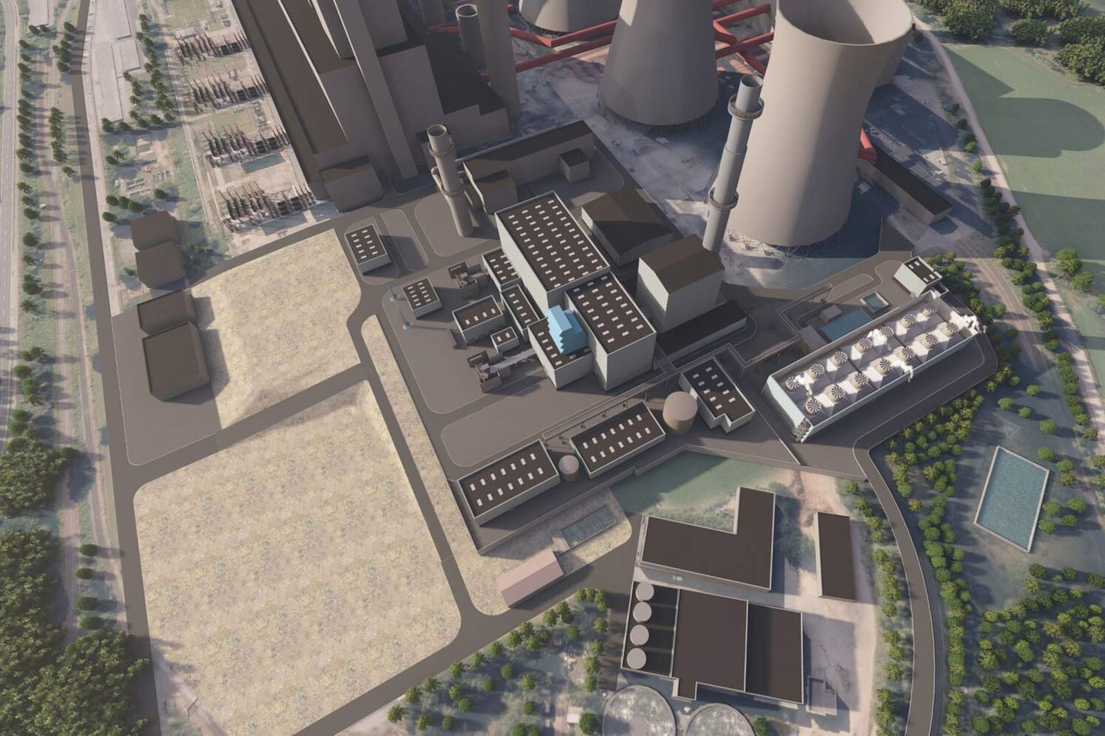 Luftaufnahme eines Industriekomplexes mit mehreren Gebäuden, Kühltürmen und Lagereinrichtungen.