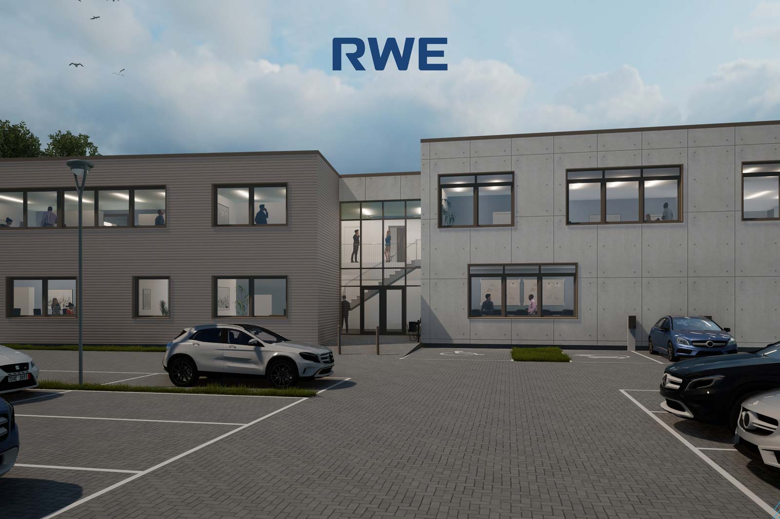 Modernes Bürogebäude mit RWE-Logo. Sichtbare Personen im Inneren, mit parkenden Autos und einem einladenden Eingangsbereich.