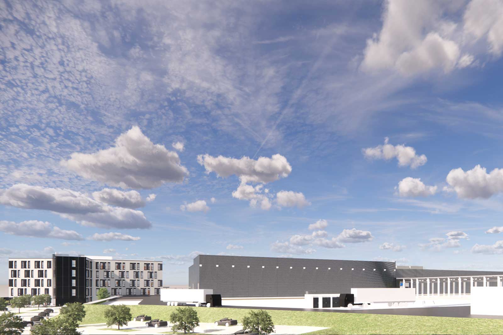 Ein modernes Gebäudeensemble mit großen Fenstern vor einem bewölkten blauen Himmel, mit Grünflächen im Vordergrund.