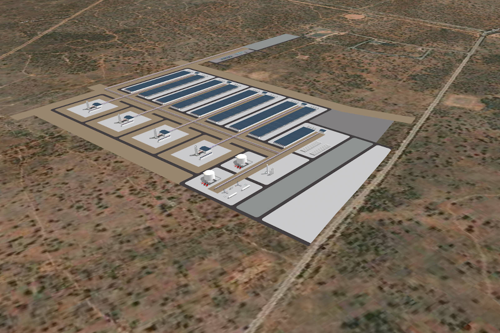 Aerial view of an industrial facility with solar panels, storage tanks, and various structures on a dry landscape.