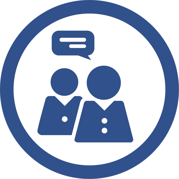 Two stylised figures in suits with a speech bubble, symbolising communication or exchange of ideas.