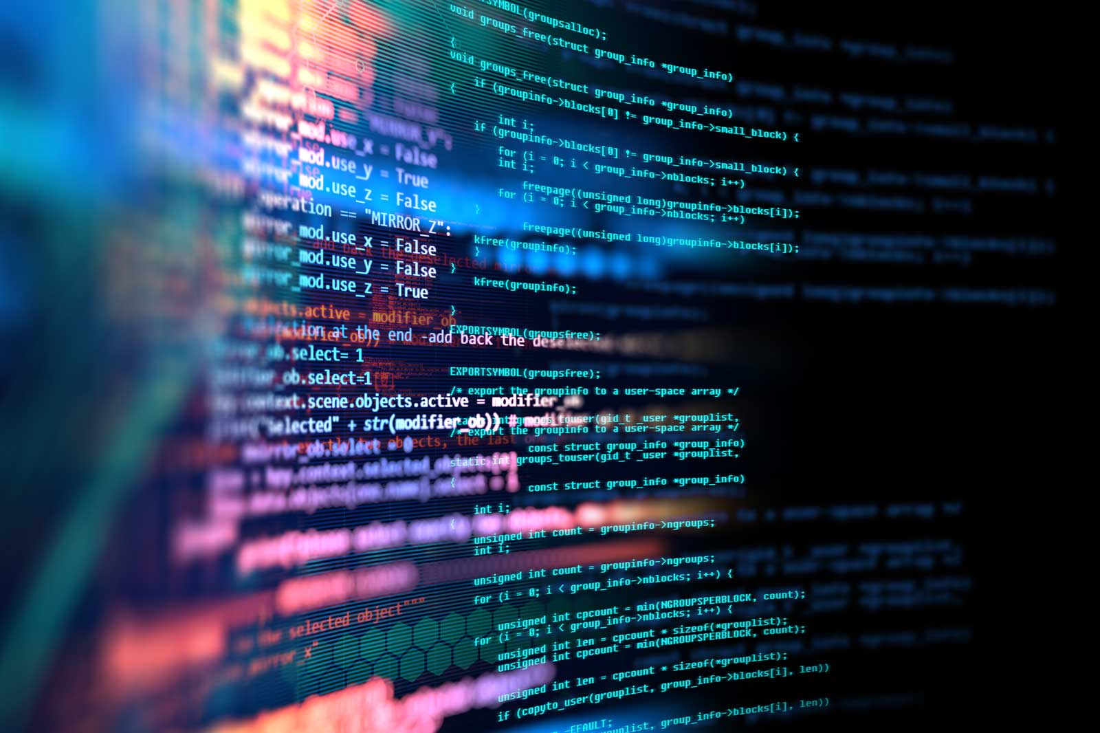 Close-up of lines of code on a screen, featuring vibrant colours that create a digital atmosphere.