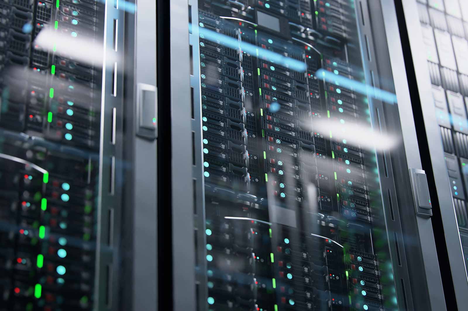 A view of a server rack with illuminated LEDs in various colours indicating the operational status of the servers.