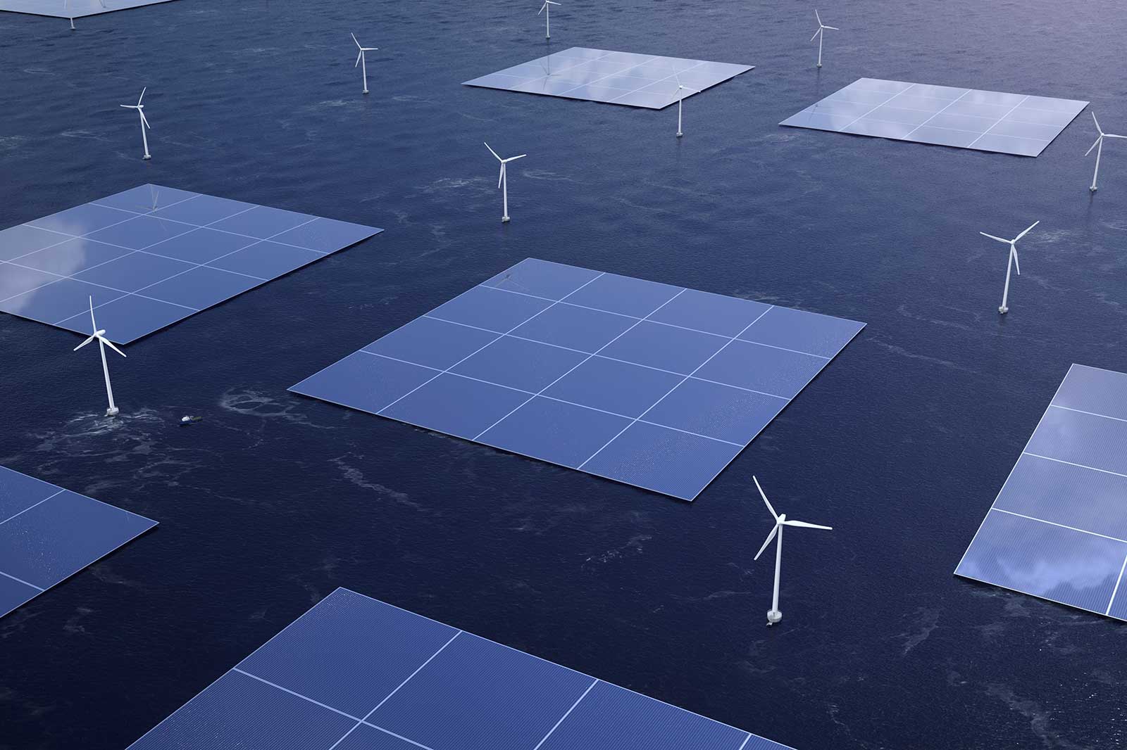 An aerial view of solar panels and wind turbines on water, symbolising sustainable energy production.