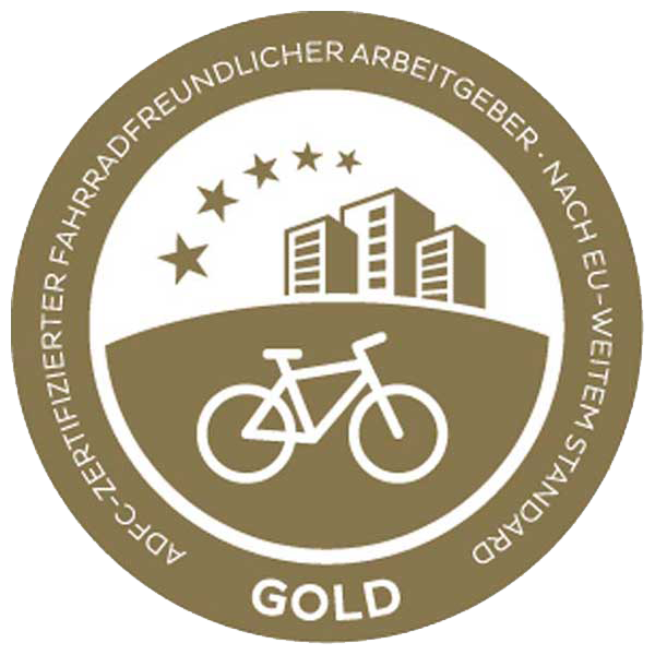 Gold award for bicycle-friendly employers, featuring a bicycle, buildings, and stars.